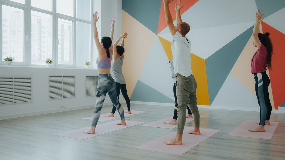 seniors doing yoga in studio
