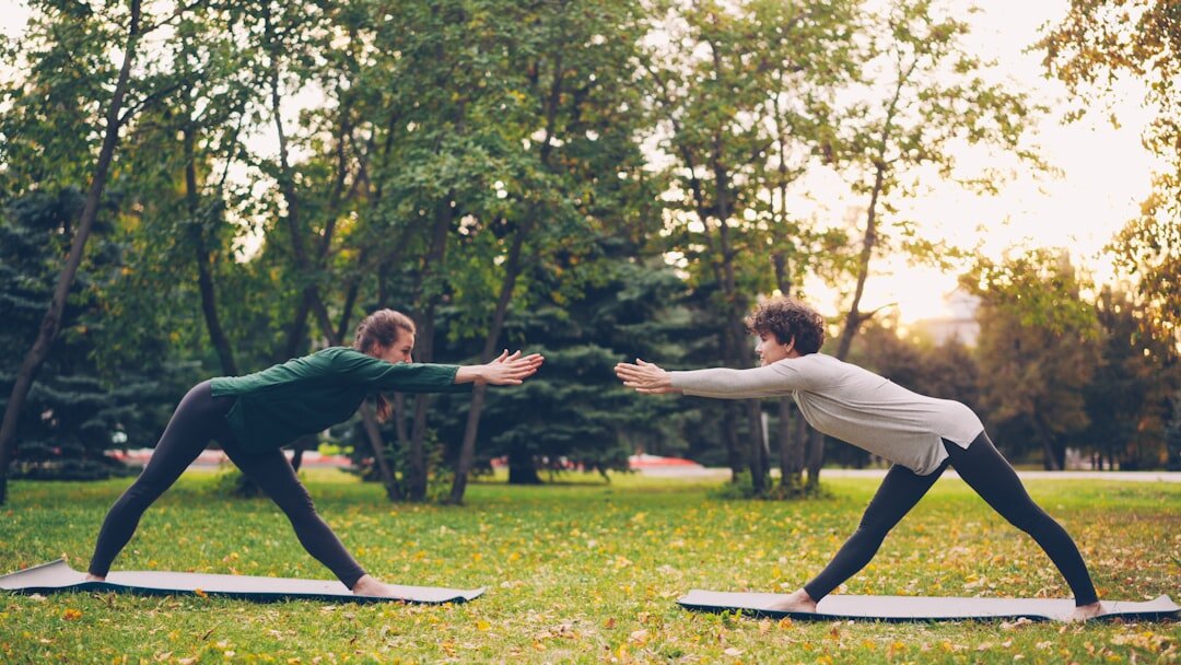 seniors doing yoga outdoors