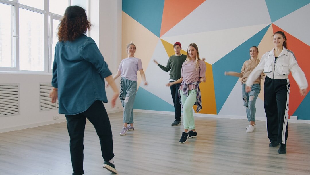 Senior couples dancing together in a bright dance studio